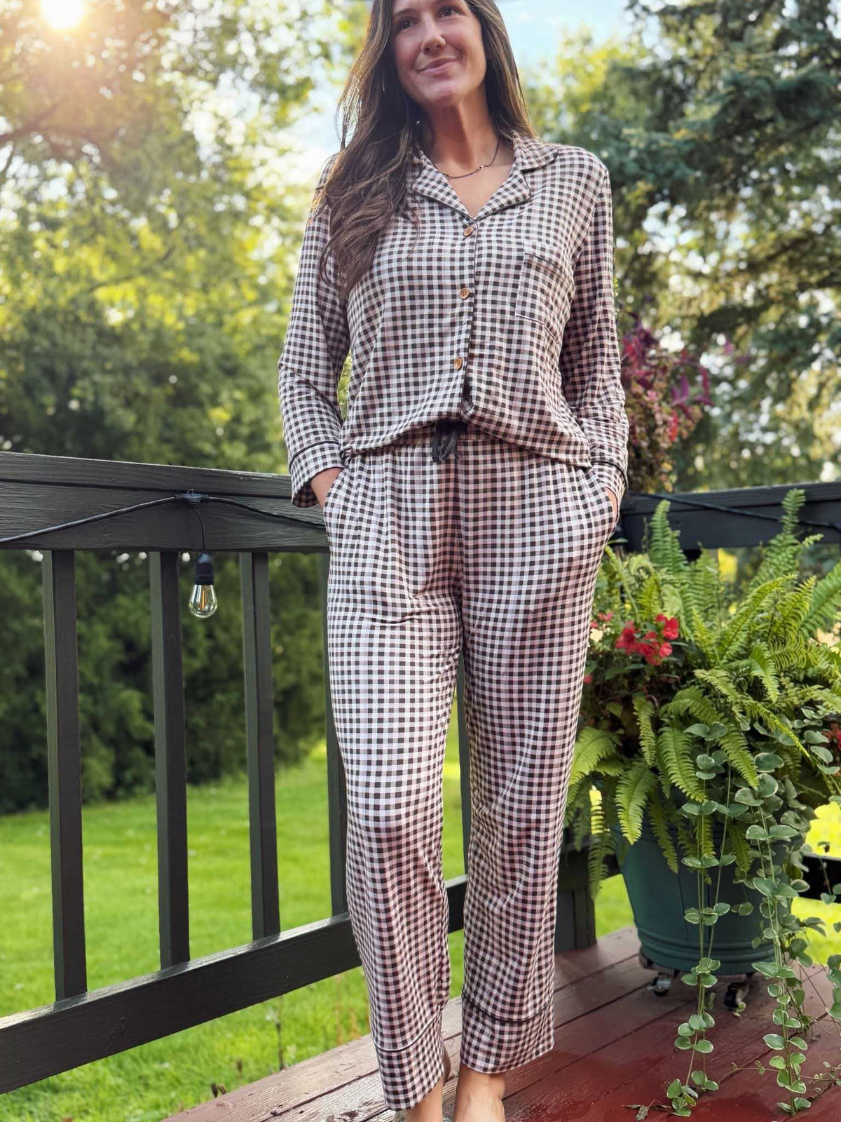 Charcoal Checkers Women's Relaxed Long-Sleeve PJ Set, worn outdoors on a deck