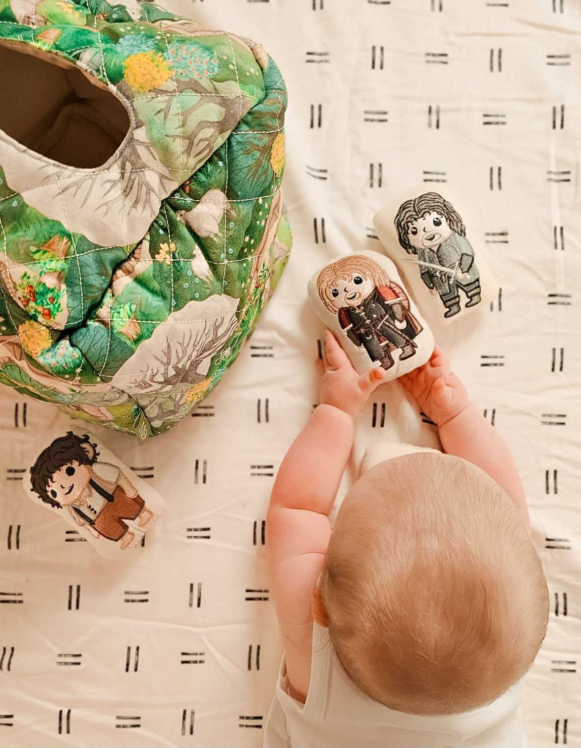 Baby playing with Fellowship Discovery Set characters
