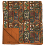 The Lord of the Rings™ Stained Glass Quilted Oversized Blanket folded, panels of the Ring, flames and swords, copper backing
